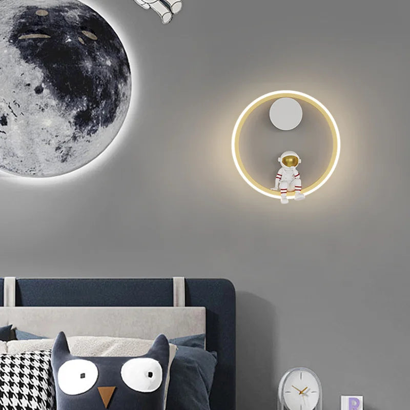 Astronaut Ring Wall Lamp — the little spaceman sitting in a halo of golden light 🚀🌕✨